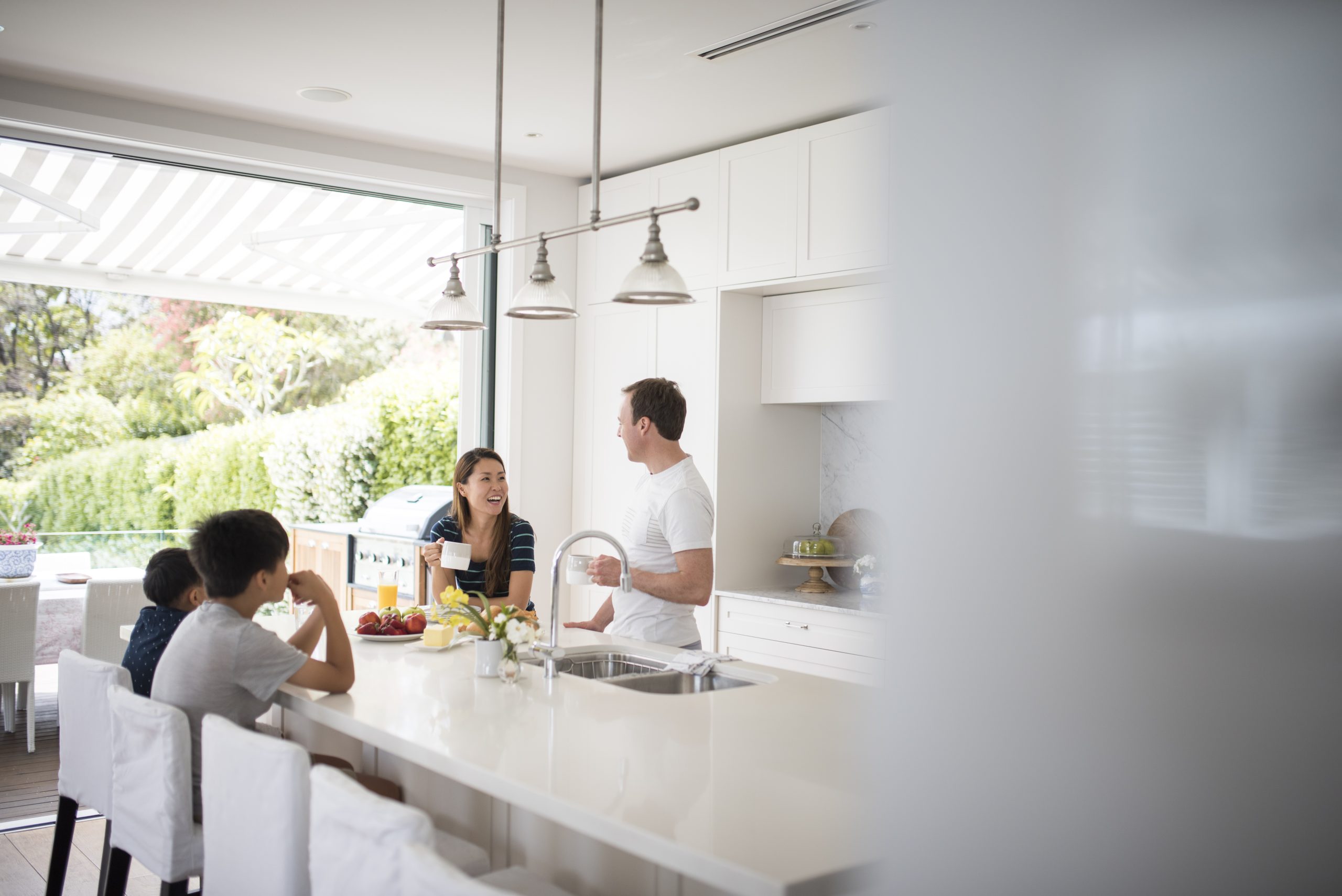 Family eating breakfast in the kitchen